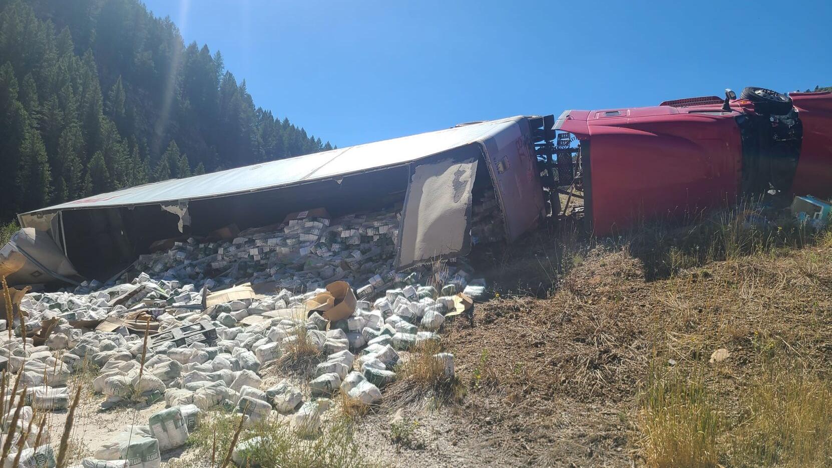 Semi tractor-trailer carrying baking flour overturns in Logan Canyon